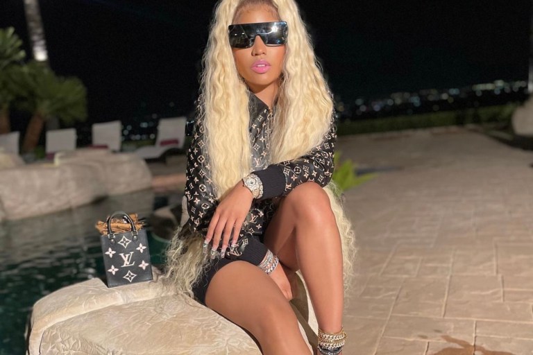 Nicki Minaj Promotes ‘Whole Lotta Money’ Remix Wearing Louis Vuitton Look Including Monogram Leather Bomber Jacket and Mini Monogram Handbag