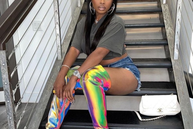 Wardrobe Inquiry: Dreezy’s Multicolor Reflective Over the Knee Boots