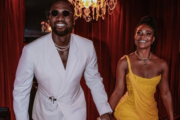 Wardrobe Inquiry: Gabrielle Union Radiates in Cong Tri Fall 2021 Yellow One Shoulder Draped Dress While Celebrating Anniversary With Dwyane Wade in Paris