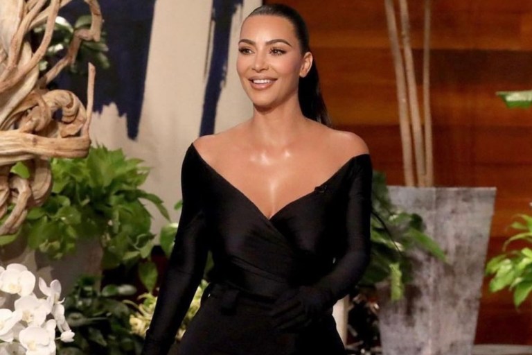 Kim Kardashian Appears on ‘The Ellen Show’ Wearing Balenciaga Black Off-the-Shoulder Gathered Top and Pantashoes