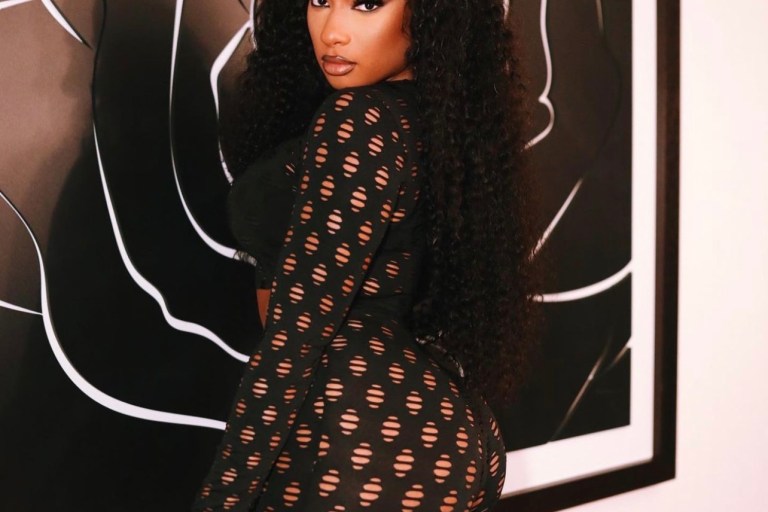 Megan Thee Stallion Pops Out in Black Distressed Long Sleeve Top and Legging Set by Fashion Nova