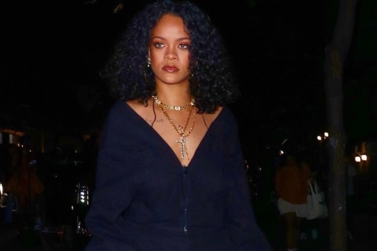 Rihanna Attends Afterparty in NYC Wearing Matthew Adams Dolan Navy Off-the-Shoulder Jumpsuit, Dior Mini Saddle Bag, and Fenty Boots