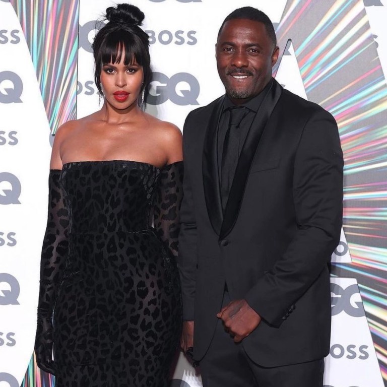 Sabrina Elba Stuns in Alex Perry Black Velvet Off-Shoulder Leopard Print Dres at GQ Awards 2021 With Idris Elba