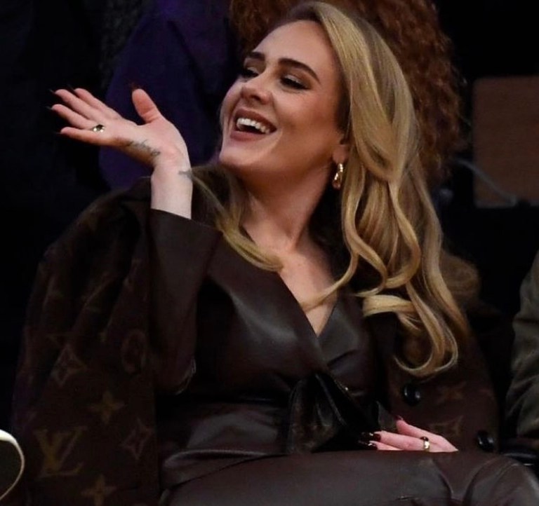 Adele Attends Lakers and Warriors Game Wearing Louis Vuitton Brown Monogram Wool Coat and Pumps