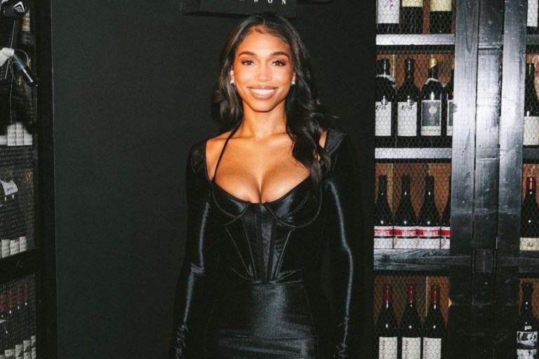 Lori Harvey Attends House of CB’s Black Orchid Collection Dinner Wearing Black Satin Corset Dress by the Brand