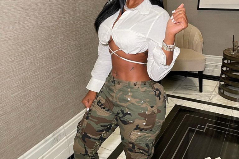 Bernice Burgos Spotted in Fashion Nova White Wraparound Tie Cropped Shirt, Camouflage Pants, and Sneakers