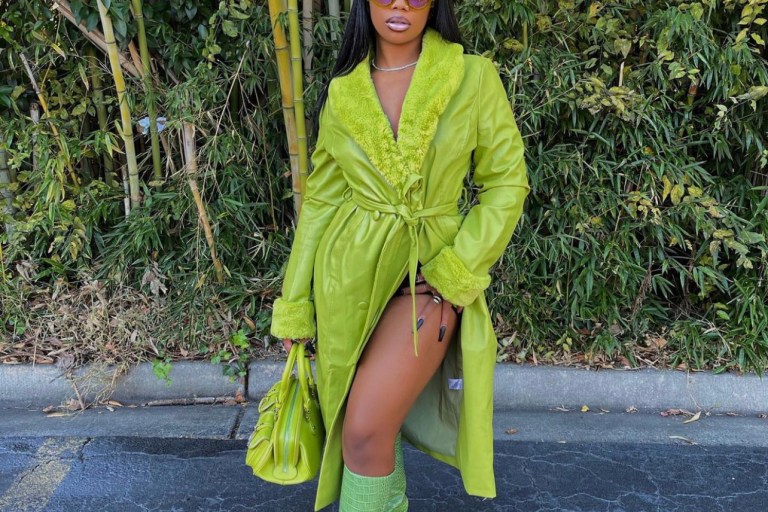 De’arra Taylor Goes All Green With Latest Look Featuring Fashion Nova Lime Green Fur-Trim Faux Leather Trench Coat