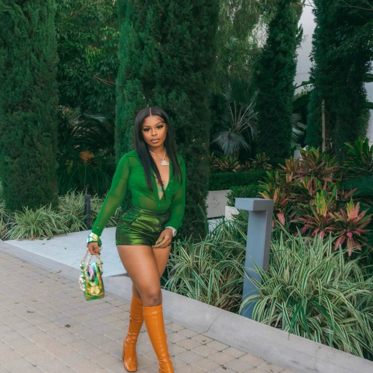 Dreezy Rocks Green Outfit Including Fashion Nova Green Mesh Bodysuit and Satin Bralette