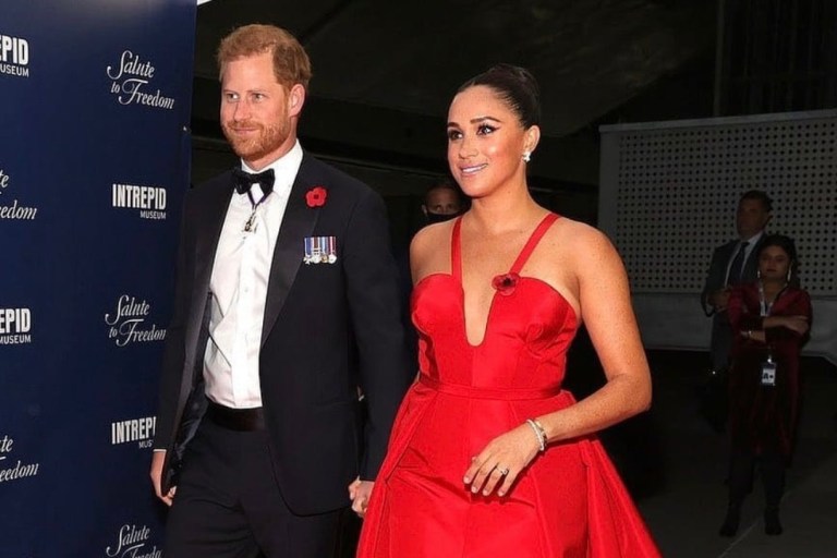 Meghan Markle Wears Carolina Herrera Red Evening Dress While Attending Intrepid Museum’s Salute to Freedom Gala With Prince Harry in New York