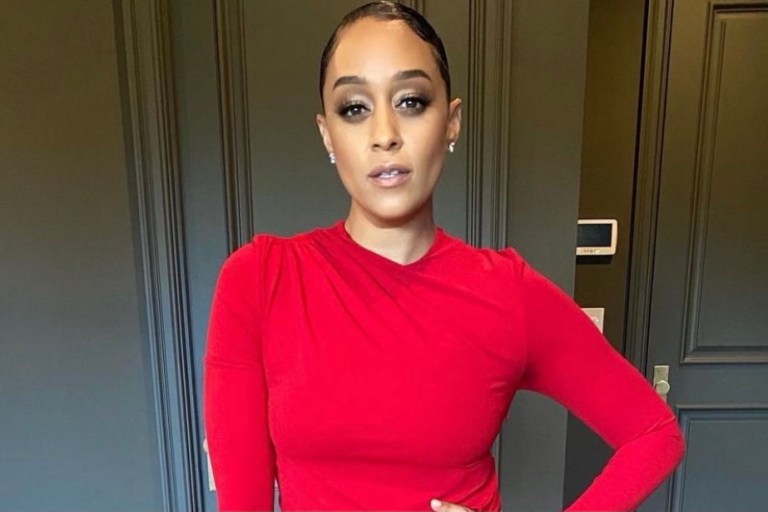 Tia Mowry Attends the EBONY Power 100 Awards Wearing Alexandre Vauthier Red Draped Thigh-Slit Dress