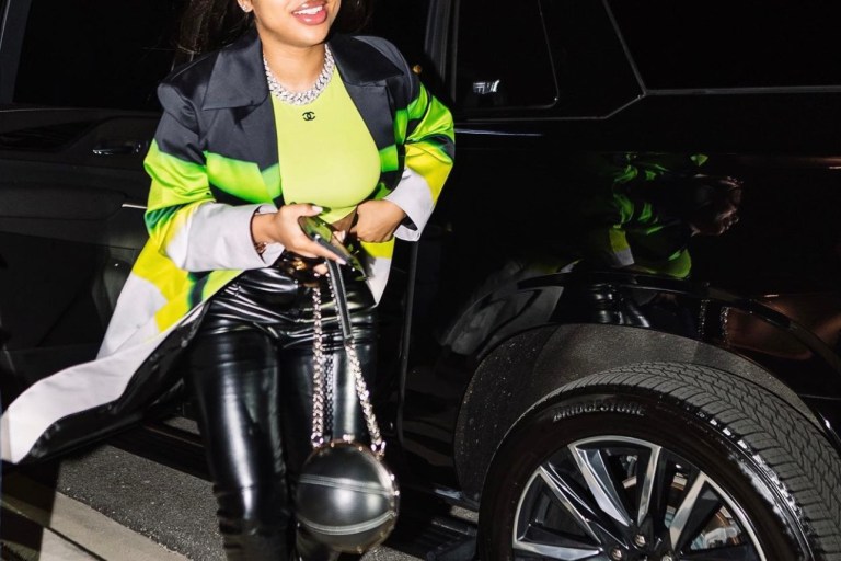 India Royale Steps Out in Neon Green and Black Look Featuring Fashion Nova Black Leather Pants