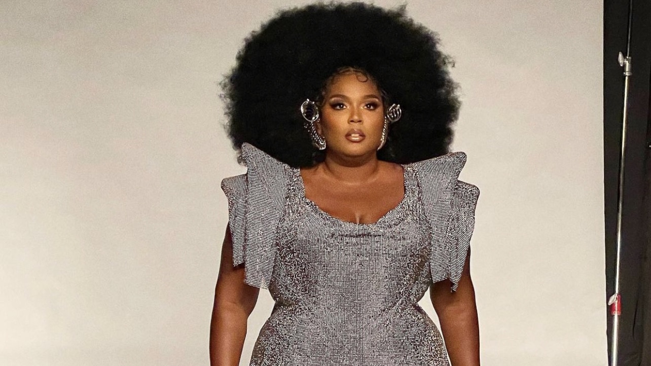 lizzo silver dress Lizzo holds hands with boyfriend Myke Wright as she flaunts her weight-loss in a silver dress with leg split as couple departs the Vogue World party in LA