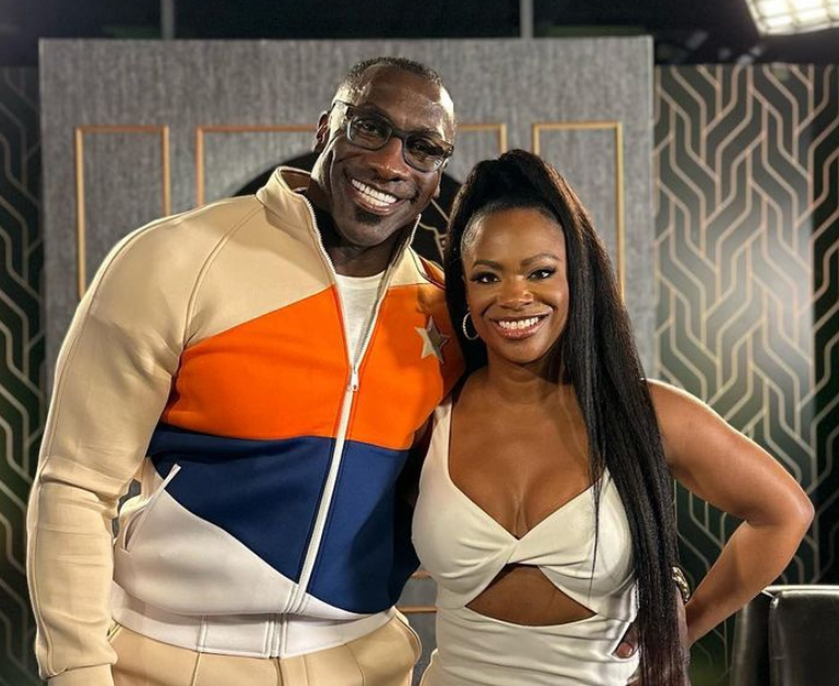 Shannon Sharpe Welcomes Kandi Burruss Onto His Talk Show Wearing a Striped Tracksuit by Starstruck
