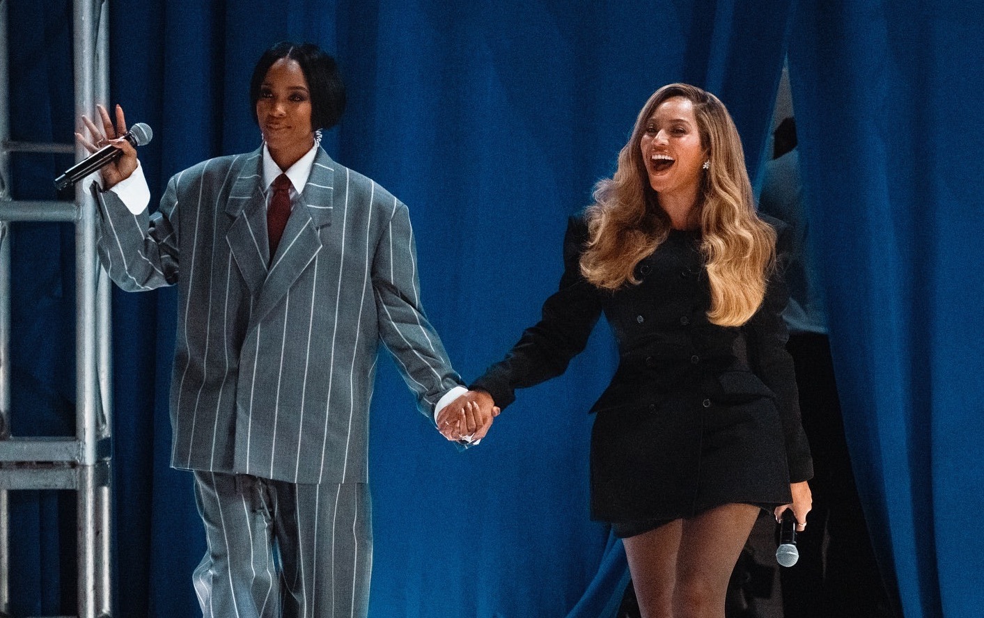 Beyonce and Kelly Rowland Campaign for Kamala Harris in Houston, with Beyonce in a Black Wardrobe NYC Blazer Dress and Kelly in a Fear of God Gray and White Striped Suit