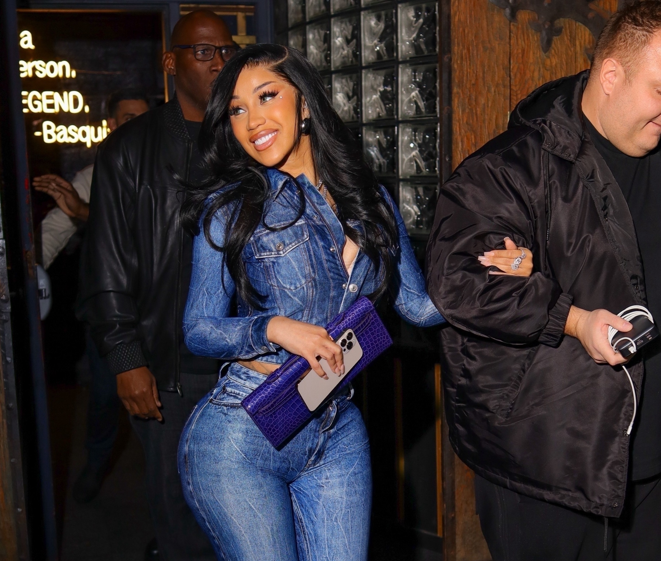 Cardi B Stops by Sei Less in a Denim Balenciaga Look, Christian Louboutin Platforms, and an Hermes Kelly Cut in Bleu Electrique