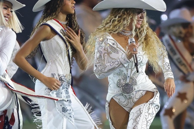 Beyonce Wears Custom Roberto Cavalli Couture White Feather Look and an ASN Cowboy Hat while Blue Ivy Wears Custom Frolov Heart and a Stetson Hat to Perform for NFL Halftime on Christmas Day!