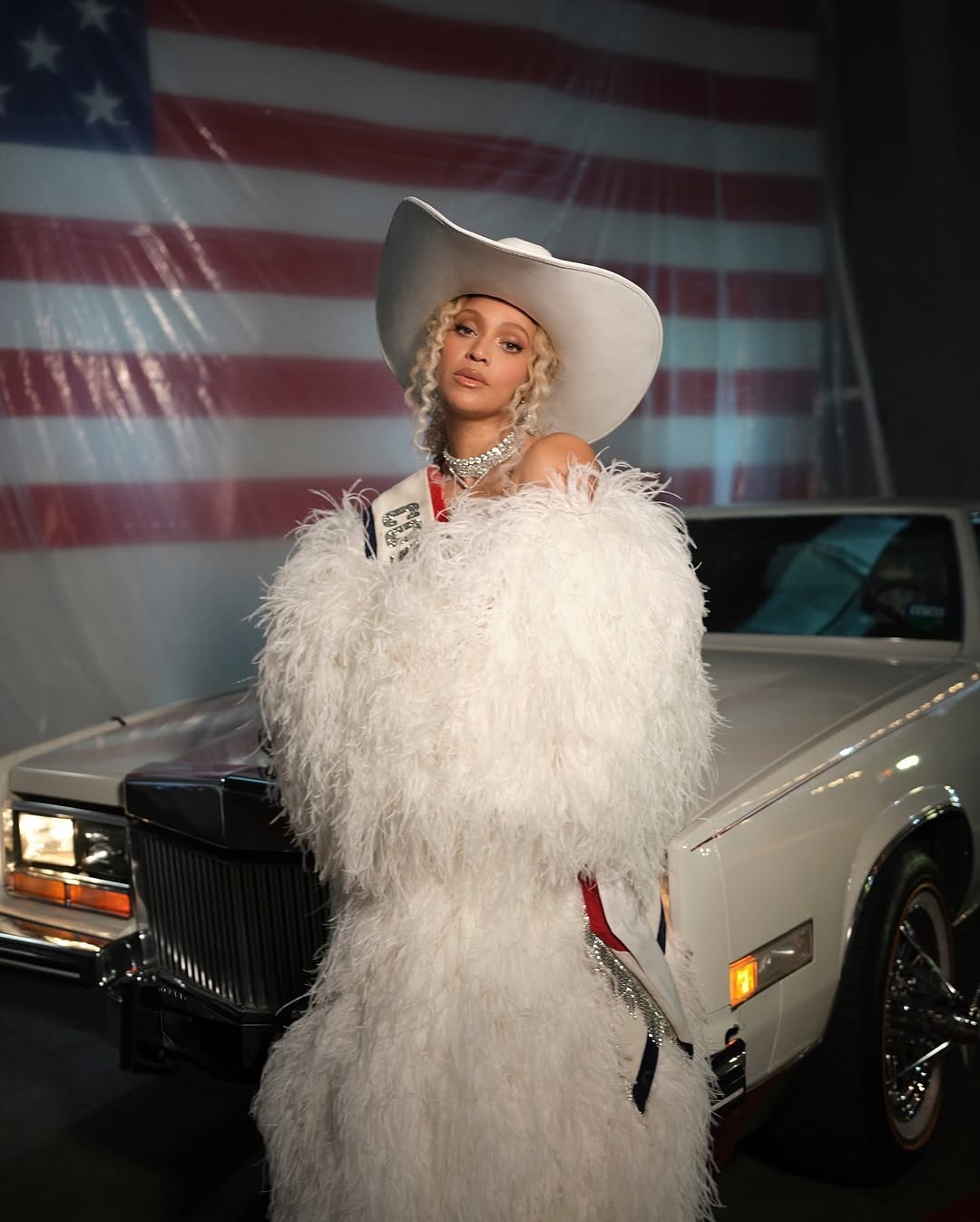 8 Beyonce Wears Custom Roberto Cavalli Couture White Feather Look And An ASN Cowboy Hat While Blue Ivy Wears Custom Frolov Heart And A Stetson Hat To Perform For NFL Halftime On Christmas Day