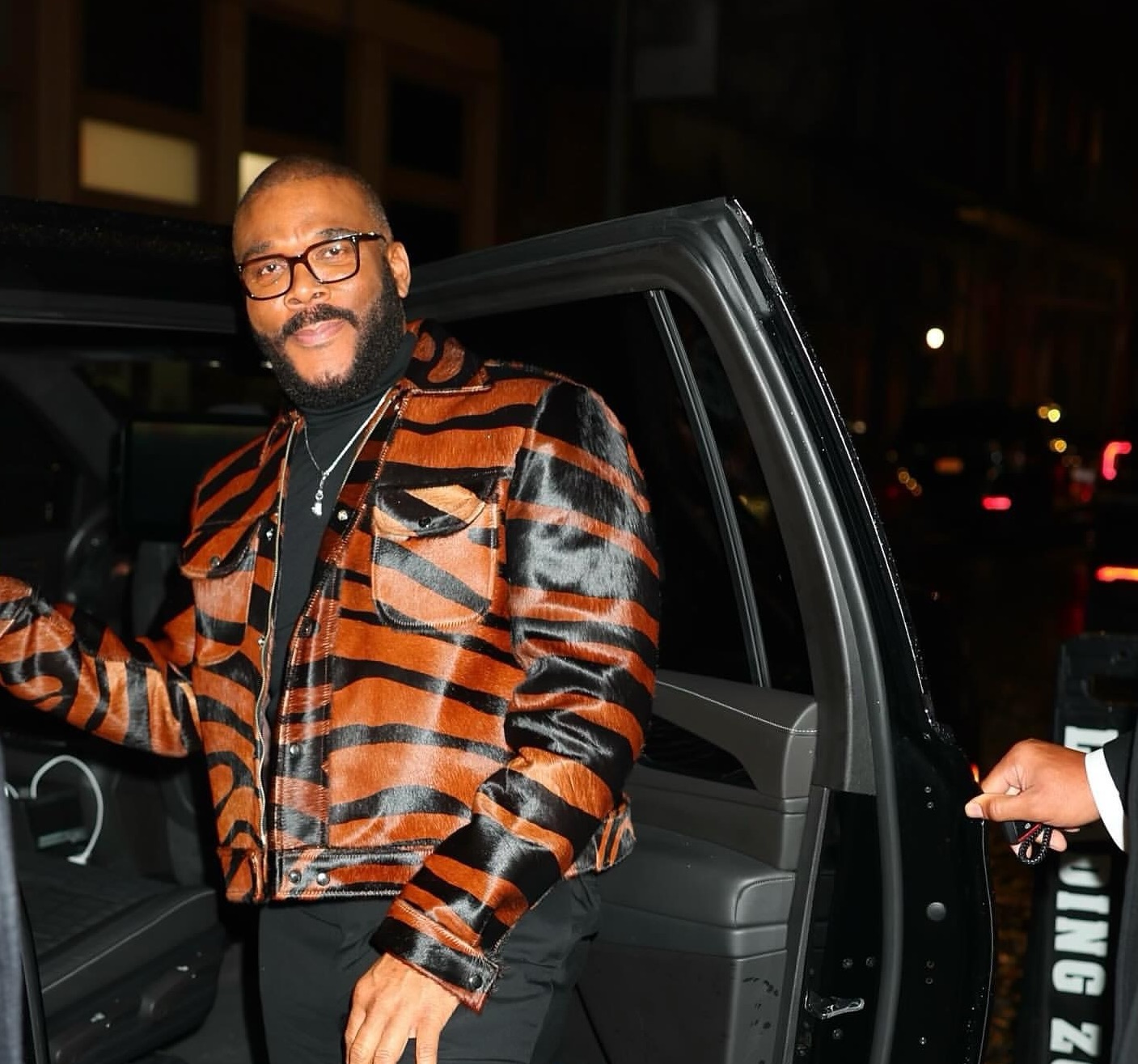 Tyler Perry Promotes Six Triple Eight in a House of Gray Custom Pony Hair Jacket