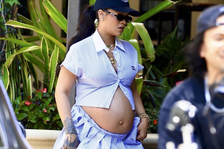 Rihanna Pairs  a Miu Miu Striped Look with a Louis Vuitton x Stephen Sprouse Bag and Louboutin Flats for Chic Maternity Street Style Moment