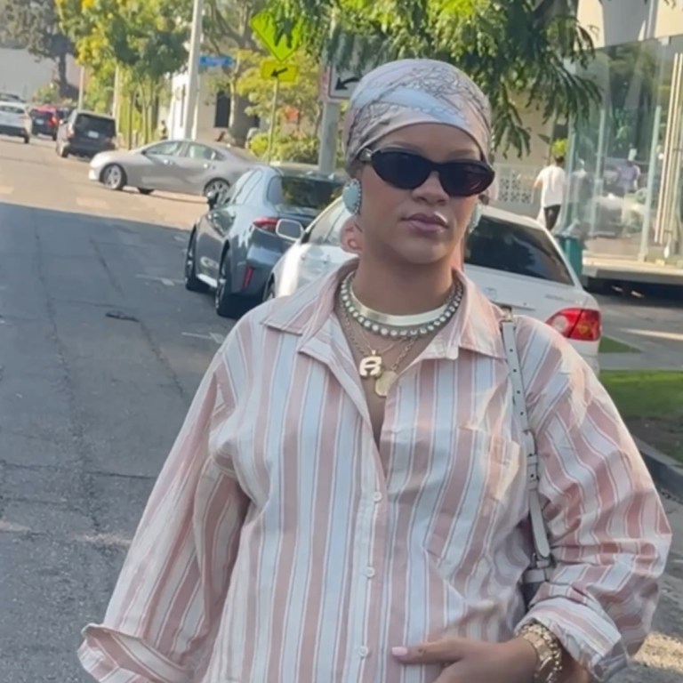 Rihanna Spotted in LA Wearing a Striped Savage x Fenty Pajama Set and Blush Satin Maison Margiela Tabi Ballet Flats