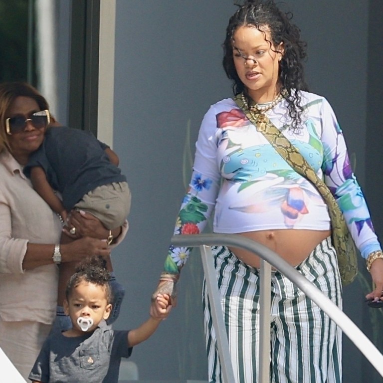 Rihanna Steps Out in Floral Chopova Lowena Blue Chameleon Top and Green-Striped Savage x Fenty Pants with Her Mom and Sons RZA and Riot in Beverly Hills