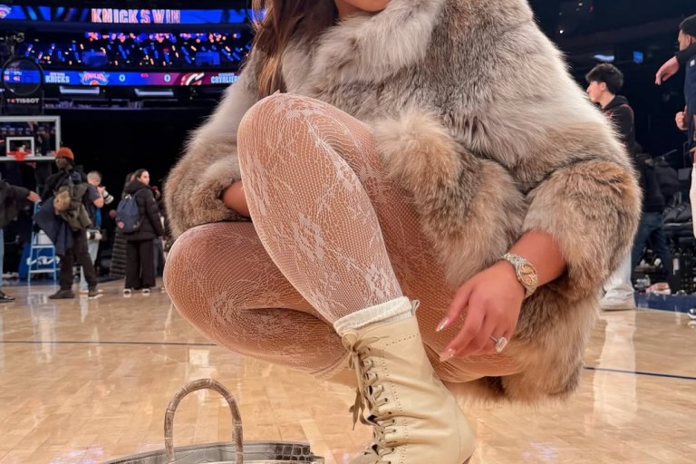 Jordyn Woods Courtside in Fur with an Hermes Himalayan Birkin and Dsquared2 Stiletto Boots