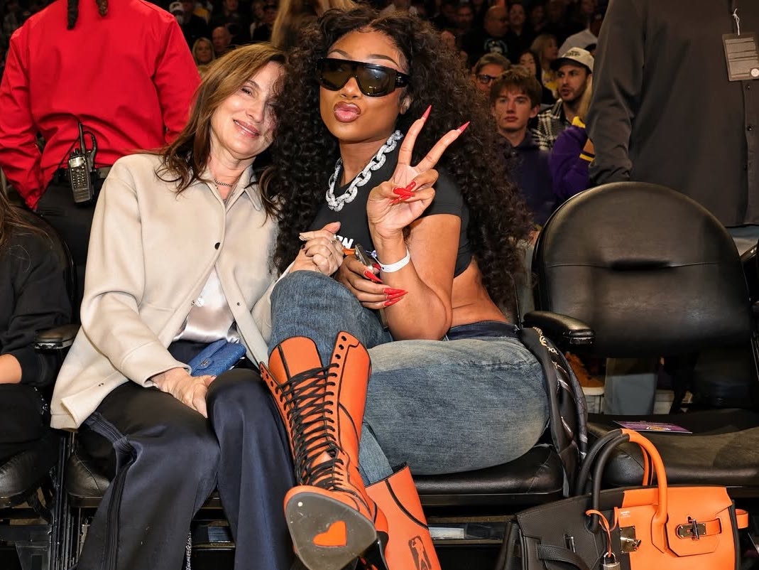 Megan Thee Stallion Courtside in Orange Lace-Up Heels and a Black