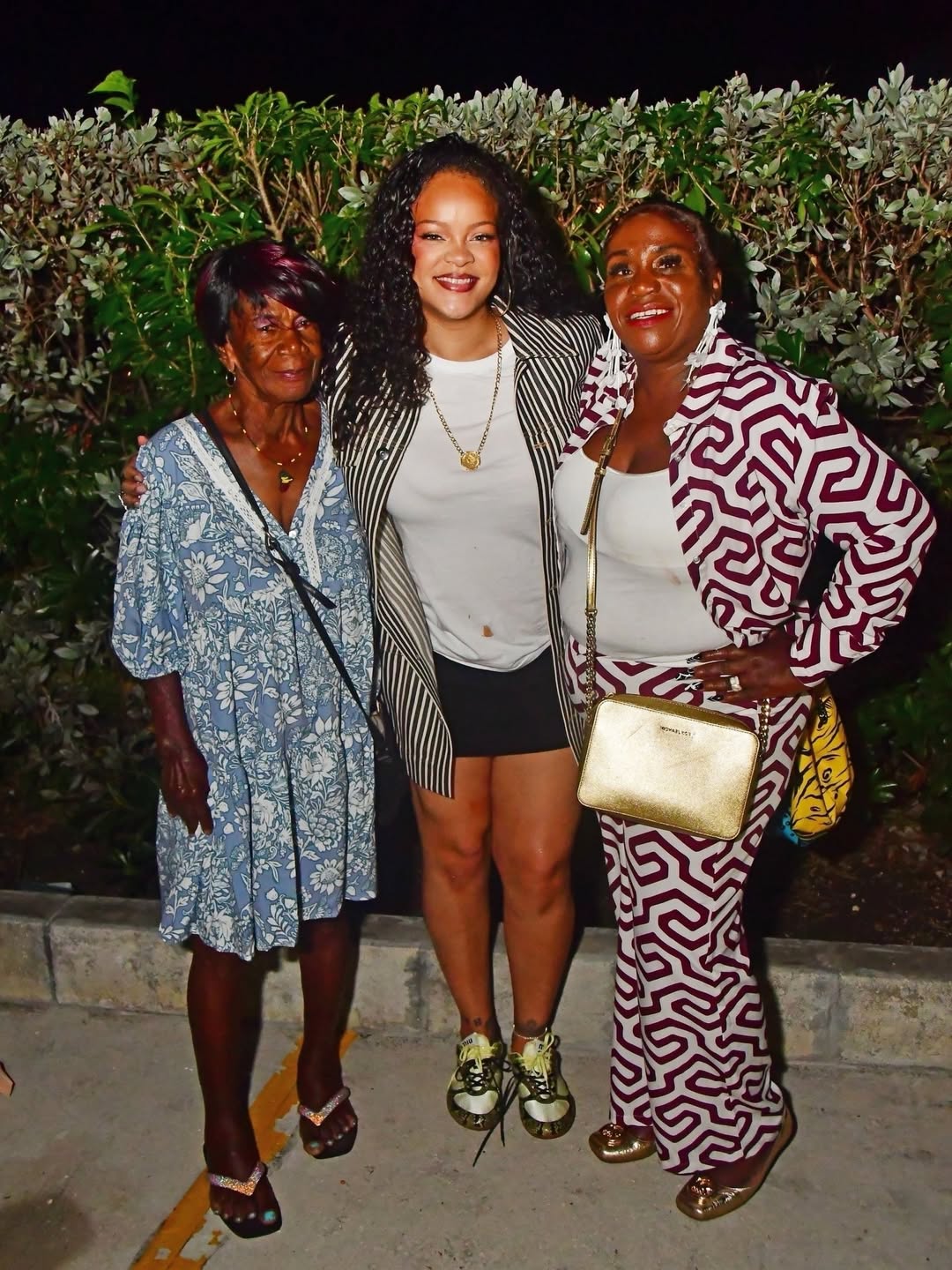 2 Rihanna Poses With Her Aunt Grandmother And Sons In Barbados Wearing A 3900 Bottega Veneta Jacket And 1350 Miu Miu Sneakers