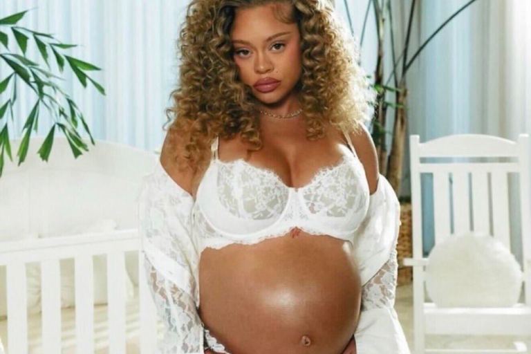 Latto Debuts Baby Bump in White Lace Lingerie and Polka Dot Set in “Business and Personal (Intro)” Video