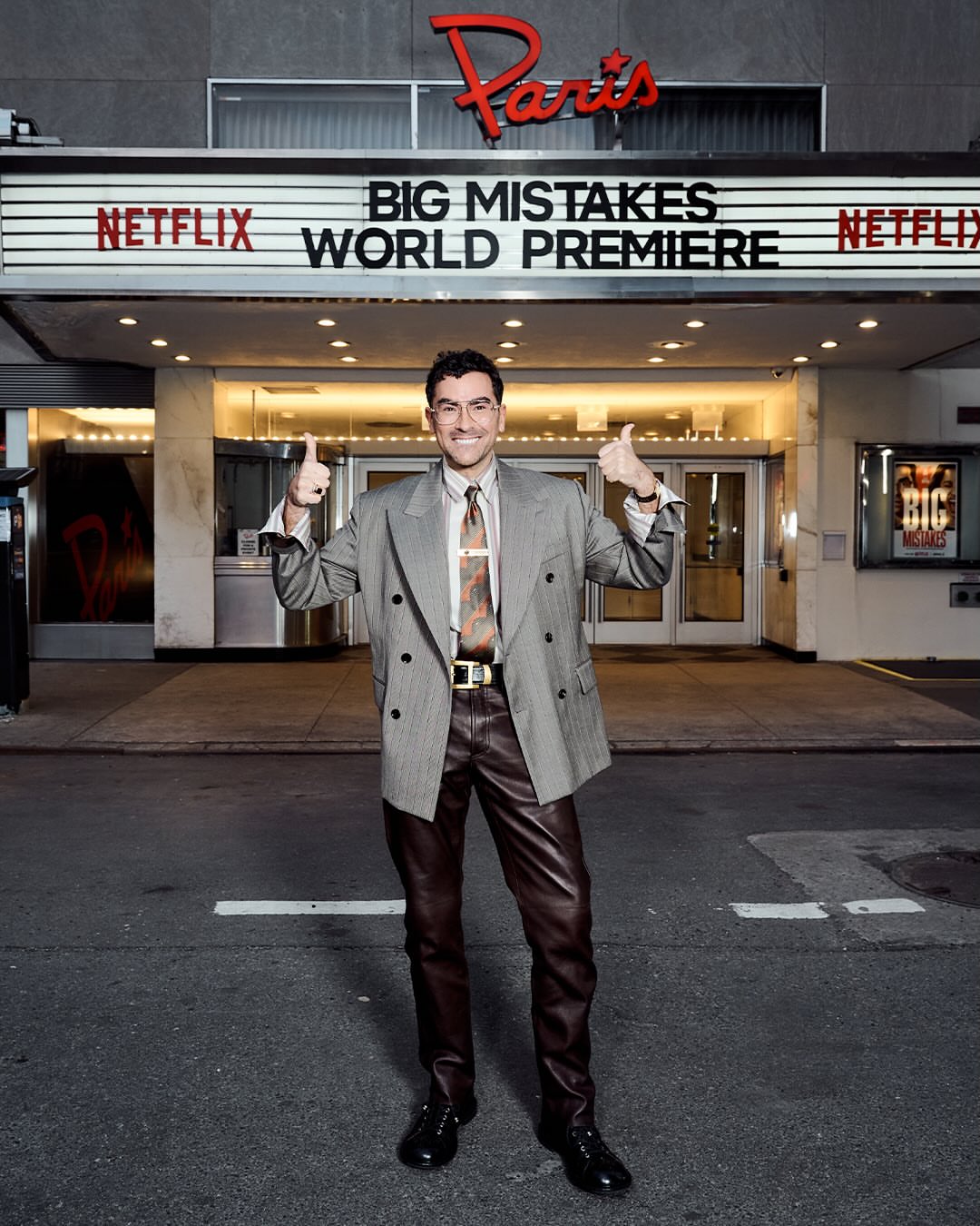 2 Dan Levy In Grey Pinstripe Versace Spring 2026 Blazer Brown Leather Pants And Silk Shirt At Big Mistakes Premiere
