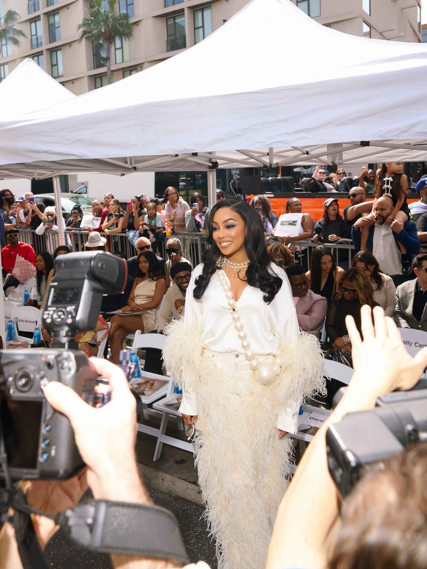 Monica Steps Out With Husband Anthony Ant Wilson At Brandys Hollywood Walk Of Fame Ceremony In Ivory Feathered LaPointe Silk Blouse And Coordinating Trousers Image 1775087584 9