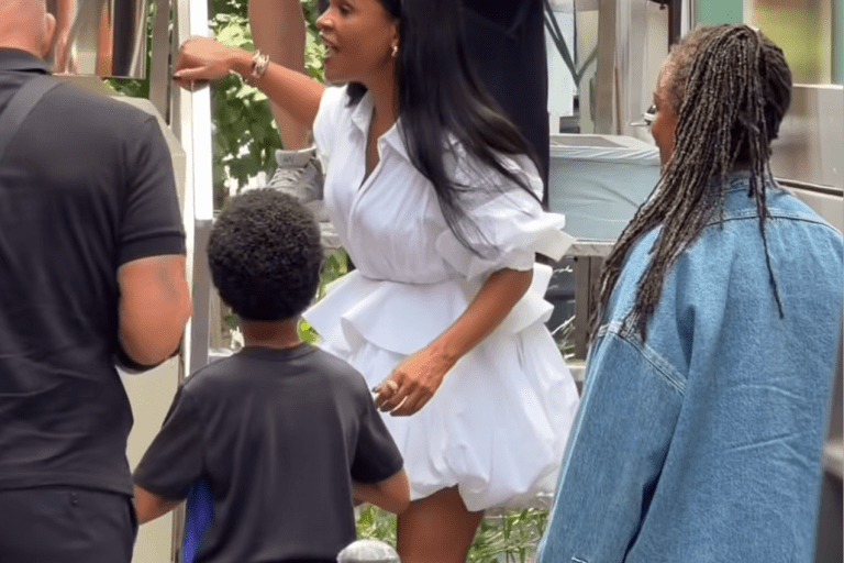 Nia Long Wore a Celine White Sculptural Shirt Dress and The Attico Ornella Dark Green Platform Stiletto Sandals at the Estée Lauder Pop-Up Bus in New York City