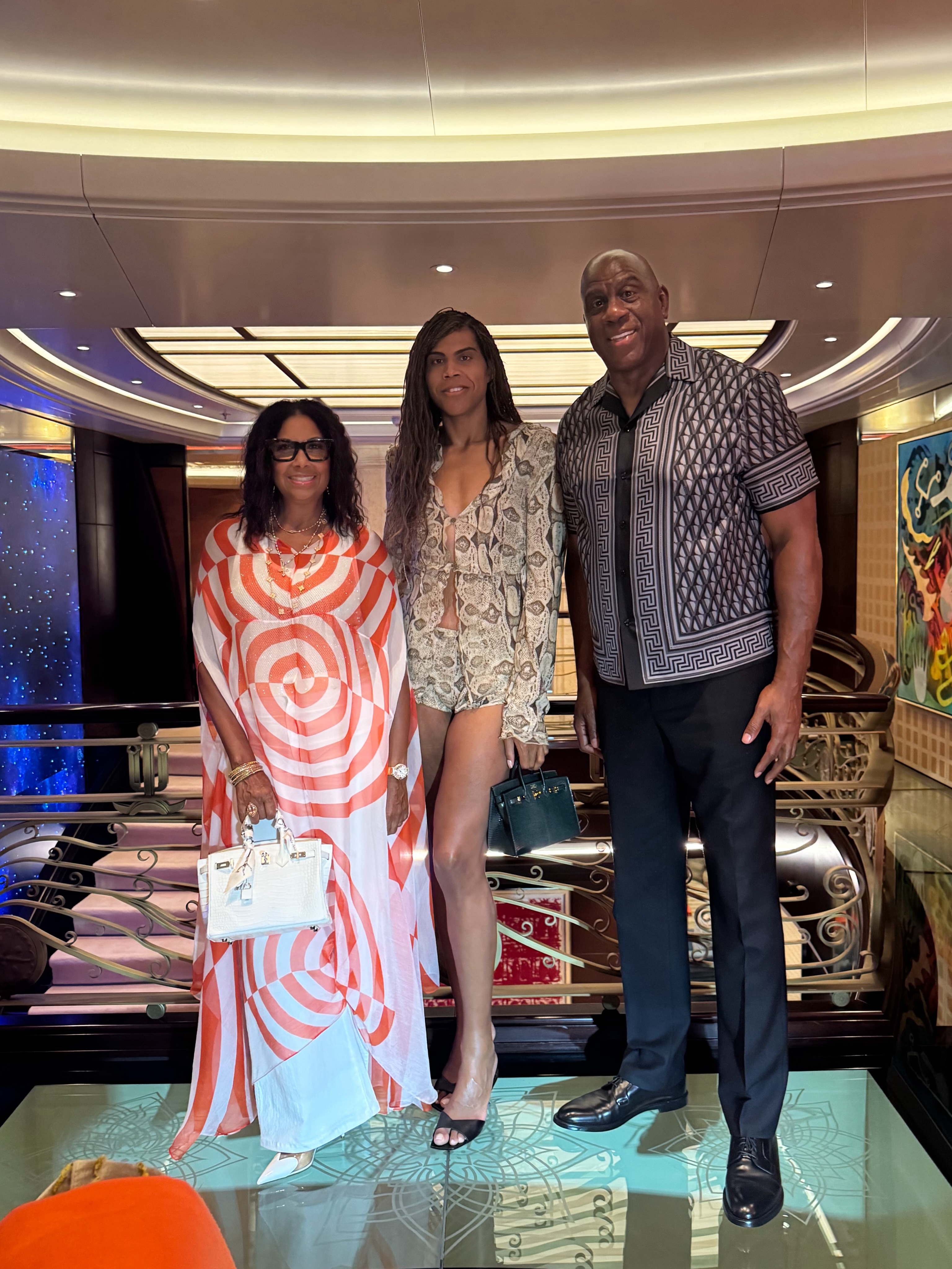 Magic Johnson Cookie Johnson In Dries Van Noten And EJ Johnson In Gucci Snake Shorts Set Enjoy Family Dinner In Croatia 1