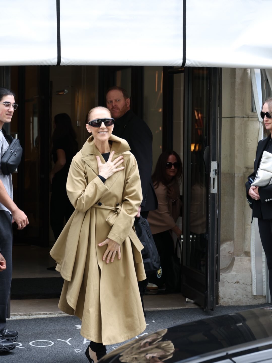 5 Celine Dion Wore An Asymmetric Caramel Alaia Trench Coat And Cutout Suede Boots In Paris